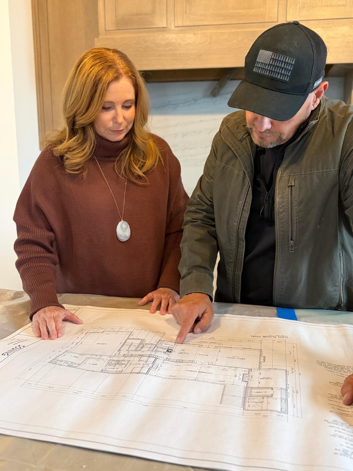 Beth and Dan reviewing home plans together